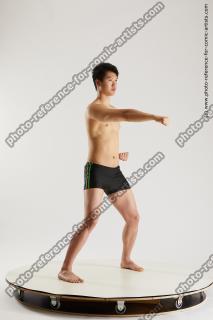 asian man taekwondo poses lan 15b